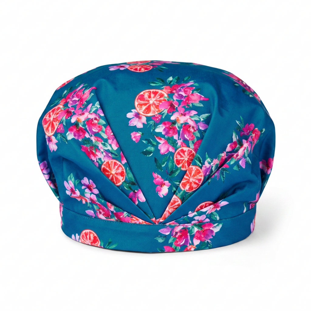 Musae Mane Shower Cap Amalfi print- blue with pink flowers and oranges on a white background. 